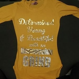 On the front it says Determined young beautiful with an unstoppable grind